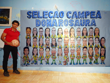 Artista pinta painel com charge de profissionais da escola que trabalha